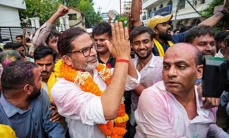 Jan Suraaj Party founder and candidate Prashant Kishor greets people during a march as he leads over BJP's Neeraj Kumar Sinha in the Bankipur bypoll