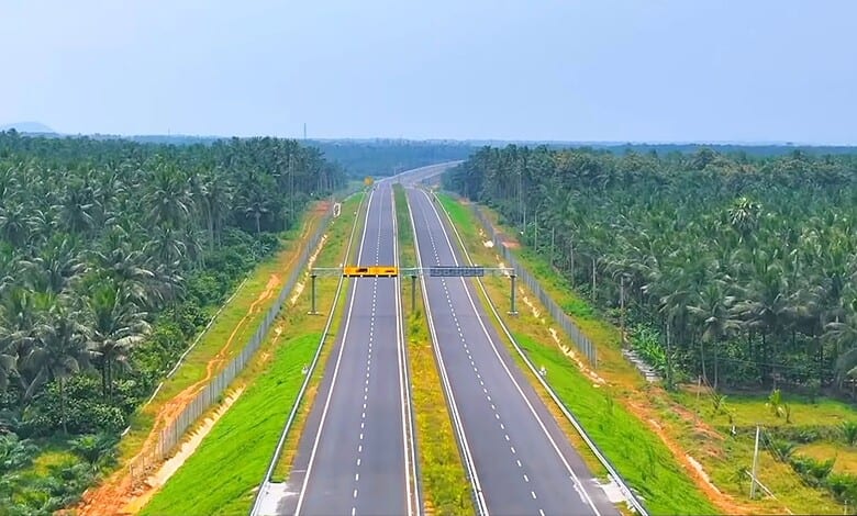New greenfield highway connecting Telangana and Andhra Pradesh, surrounded by lush greenery.