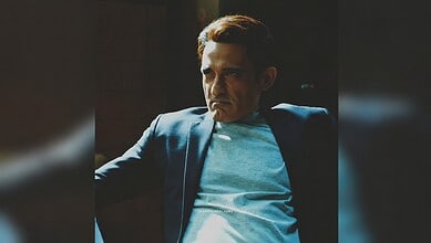 Akshaye Khanna in Mahakali costume with intense expression, dark background, dramatic lighting.