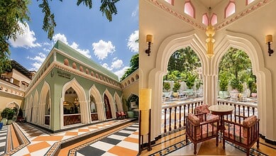 Beautiful view of a palace with intricate architecture and lush greenery in the background.