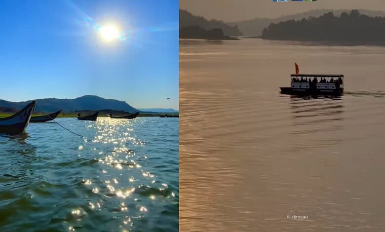 Scenic view of backwaters near Hyderabad with boats under a bright sun and calm waters.