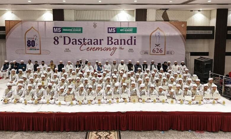 Group of children in white traditional attire at MS Hifz Academy's eighth Dastarbandi ceremony.