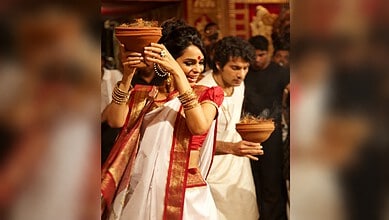 Mallika Sherawat in traditional attire during a cultural event at the temple.