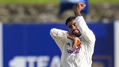 Cricketer Suthar celebrating after taking 10 wickets in a match.