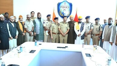 Hyderabad police officials and community leaders gather for a meeting during Milad-un-Nabi celebrations.