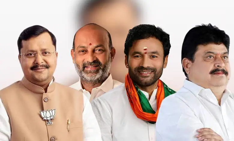 Indian political leaders at a public event, smiling and dressed in traditional attire.