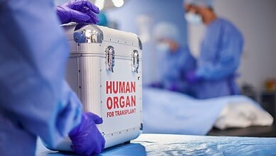 Medical team handling human organs for transplant in a hospital setting.