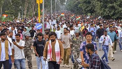 Protesters march with Indian flags during Jharkhand assembly protest.