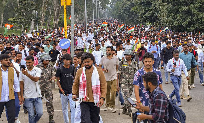 Protesters march with Indian flags during Jharkhand assembly protest.