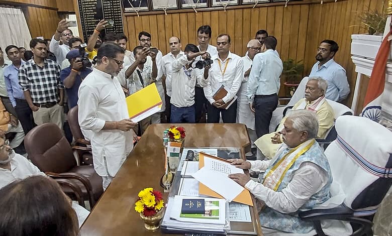Prashant Kishor taking oath as Bihar MLA in a formal ceremony with officials and media present.
