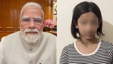 Indian Prime Minister Narendra Modi with a woman in a striped shirt, both indoors.