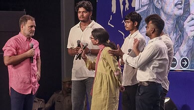 Rahul Gandhi interacts with young students during a public event in India.