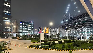 Night view of Hyderabad city with modern buildings and illuminated streets.