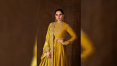 Sania Mirza in a yellow traditional outfit with intricate embroidery and jewelry.
