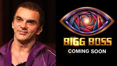 Sohail Khan in a purple jacket, promoting Bigg Boss with a colourful eye logo.