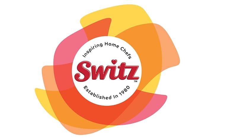 Switz Foods logo with colourful abstract background, inspiring home chefs since 1980.