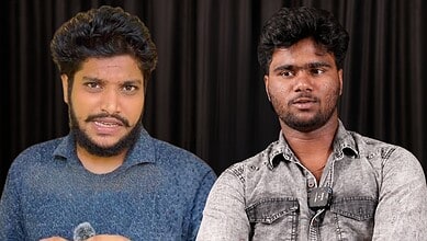 Two young men speaking at a press conference with a black curtain backdrop.