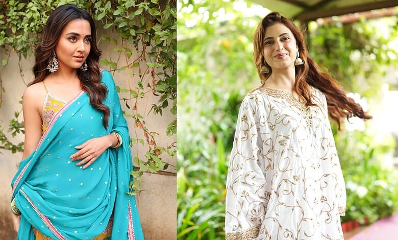 Tejasswi Prakash in a blue saree with traditional jewelry, posing outdoors with greenery in the backdrop.