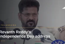 Telangana CM Revanth Reddy delivering Independence Day address with microphone and police officer nearby.