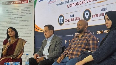 Panel discussion at a media event with four diverse speakers on stage.