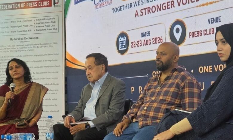 Panel discussion at a media event with four diverse speakers on stage.