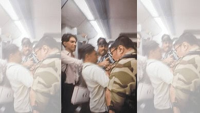 CISF jawan waving firearm and clicking pictures inside Delhi Metro.