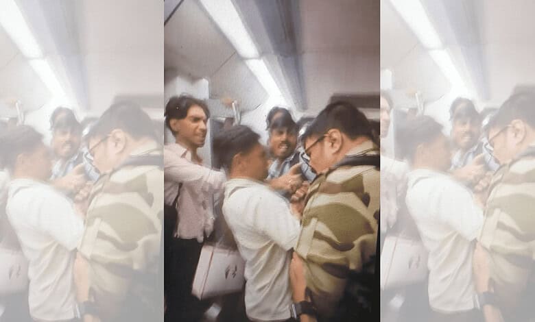 CISF jawan waving firearm and clicking pictures inside Delhi Metro.
