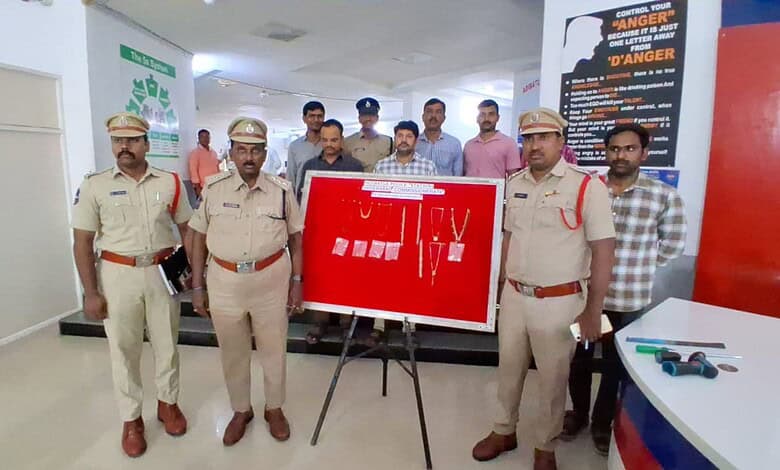 Police officers with suspects and seized items at Adibatla police station.