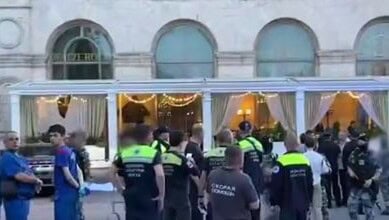 Police and emergency responders at the scene of a Moscow restaurant bombing incident.