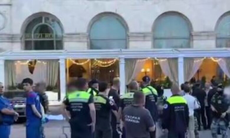 Police and emergency responders at the scene of a Moscow restaurant bombing incident.