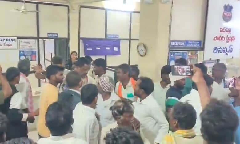 Crowd gathered inside Sangareddy police station amid protests and media coverage.