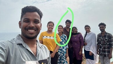 Group of six friends enjoying a day at the beach in Visakhapatnam, smiling and posing for a selfie.