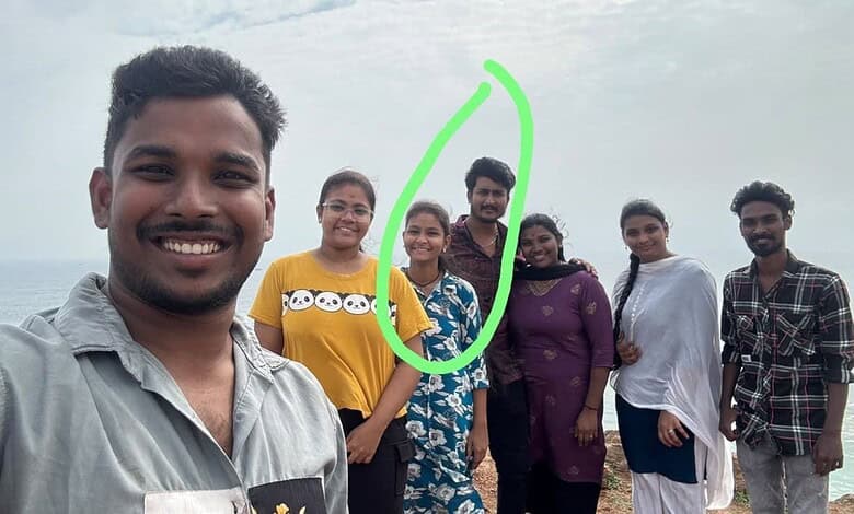 Group of six friends enjoying a day at the beach in Visakhapatnam, smiling and posing for a selfie.