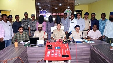 Police officials and suspects during a press conference in Adilabad, India.