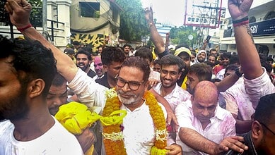 Celebration of Holi festival with people throwing colours and enjoying in the street.