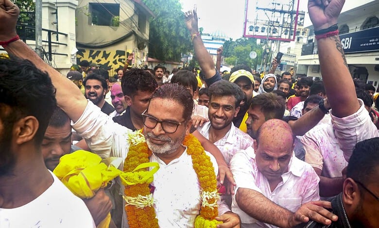 Celebration of Holi festival with people throwing colours and enjoying in the street.