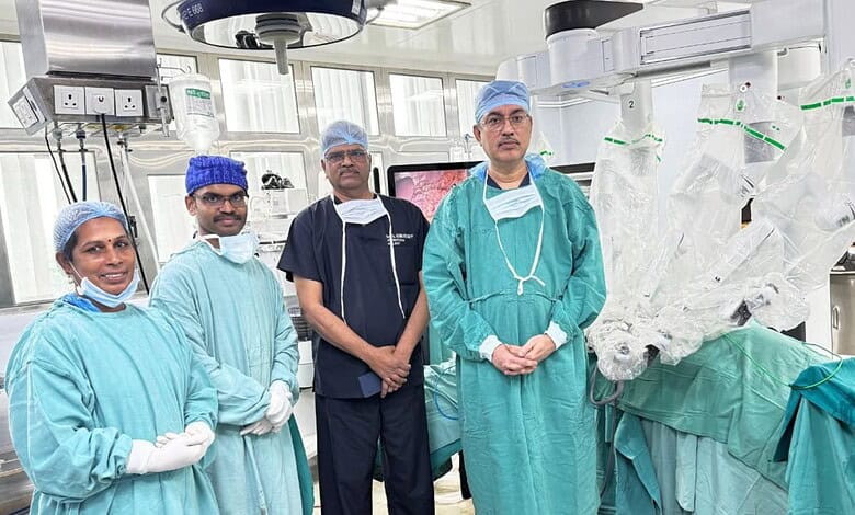Medical team performing robotic surgery in a modern operating room.