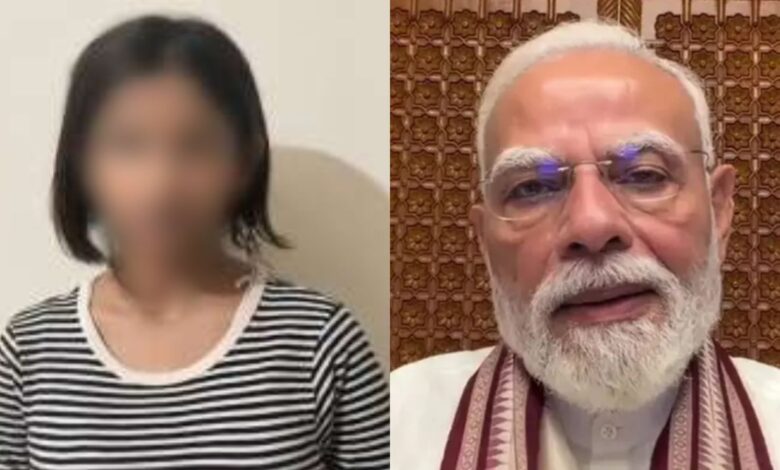 Indian Prime Minister Narendra Modi with a woman in a striped shirt.
