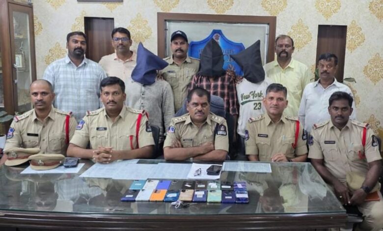 Hyderabad police display seized mobile phones and arrest suspects in a press conference.