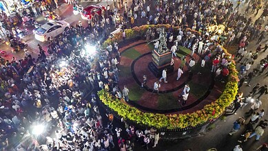 Crowd gathered around a monument during a protest in Jharkhand, India.