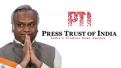 Kharge with folded hands, Press Trust of India logo in background, India news.