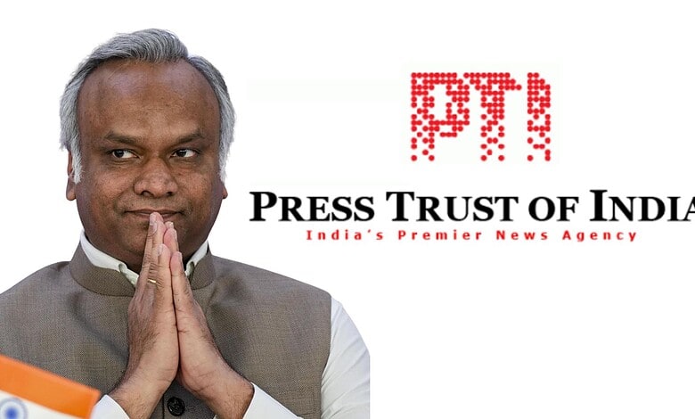 Kharge with folded hands, Press Trust of India logo in background, India news.