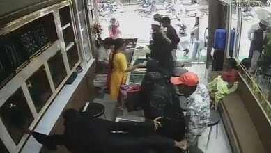Women in burqas steal a gold chain from a Vikarabad store, CCTV footage captures the incident.