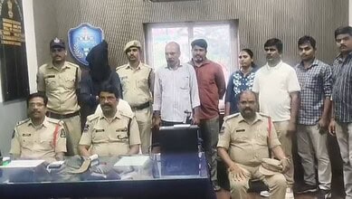 Police officers and individuals in a room related to Saidabad murder case.