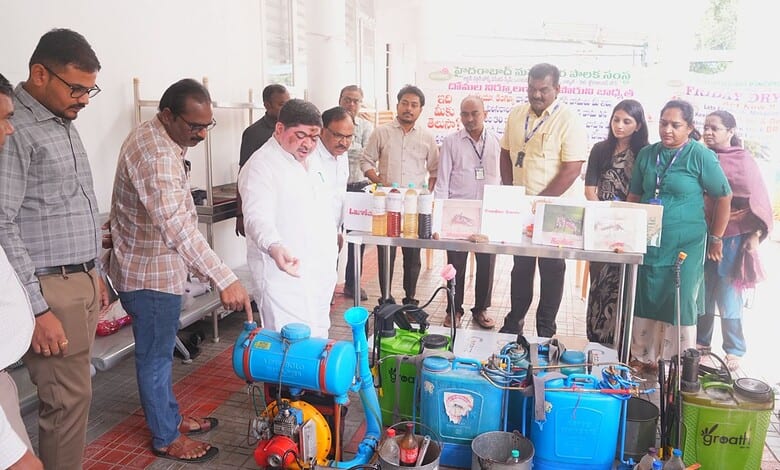 Officials inspect water pumping equipment at a public event in Hyderabad.