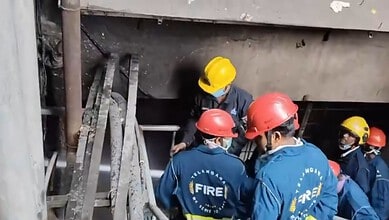 Firefighters in protective gear respond to a fire incident at Banjara Hills.