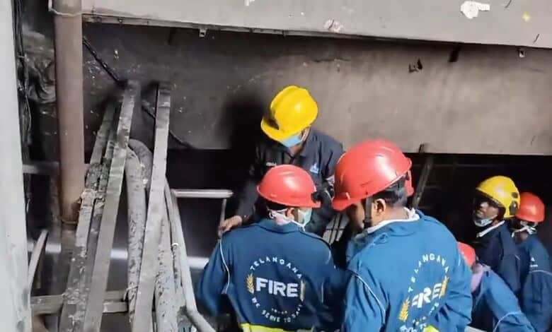 Firefighters in protective gear respond to a fire incident at Banjara Hills.