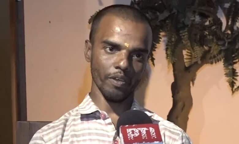 Hyderabad Rapido rider speaks into microphone amid daily struggles, with a tree in the background.