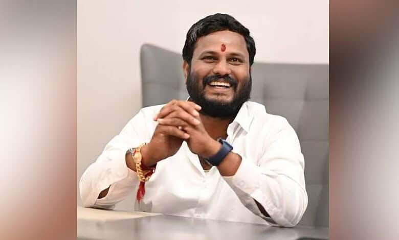 Telangana Congress leader Neelam Madhu Mudiraj smiling in an office setting.
