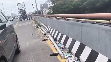 Litter and broken bottles scattered along PVNR Expressway in Hyderabad.